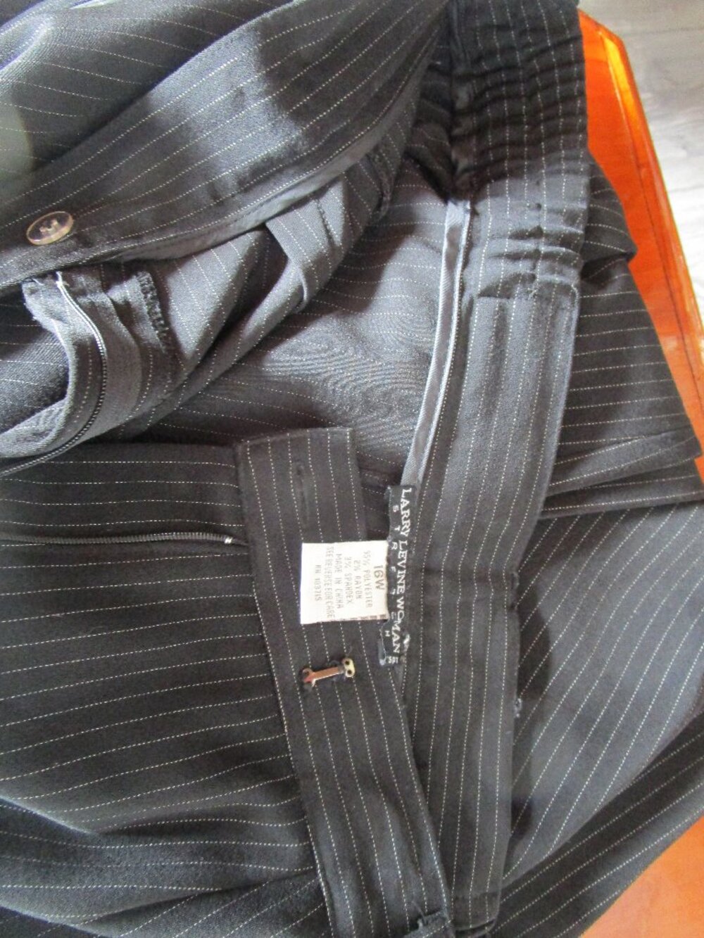 Black pinstripe dress pants with cuff hem. 16W stretch like new.